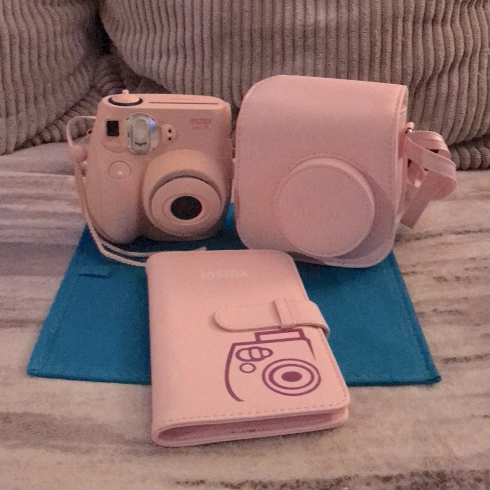 Polaroid camera with case and a photo album